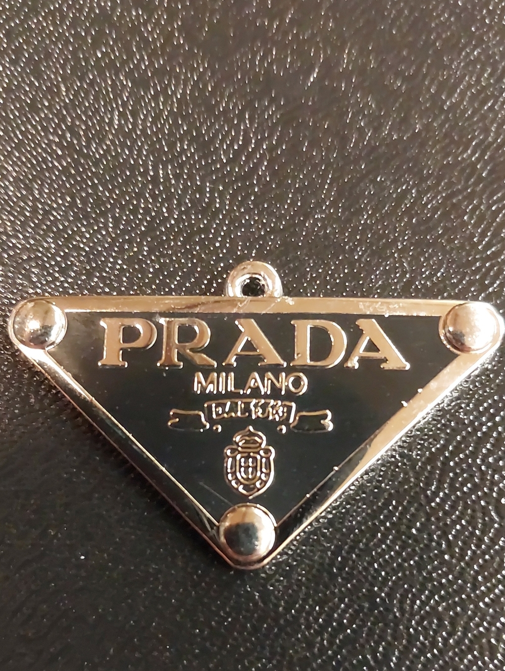 Prada Black Triangle Logo Pendant with Silver Accents